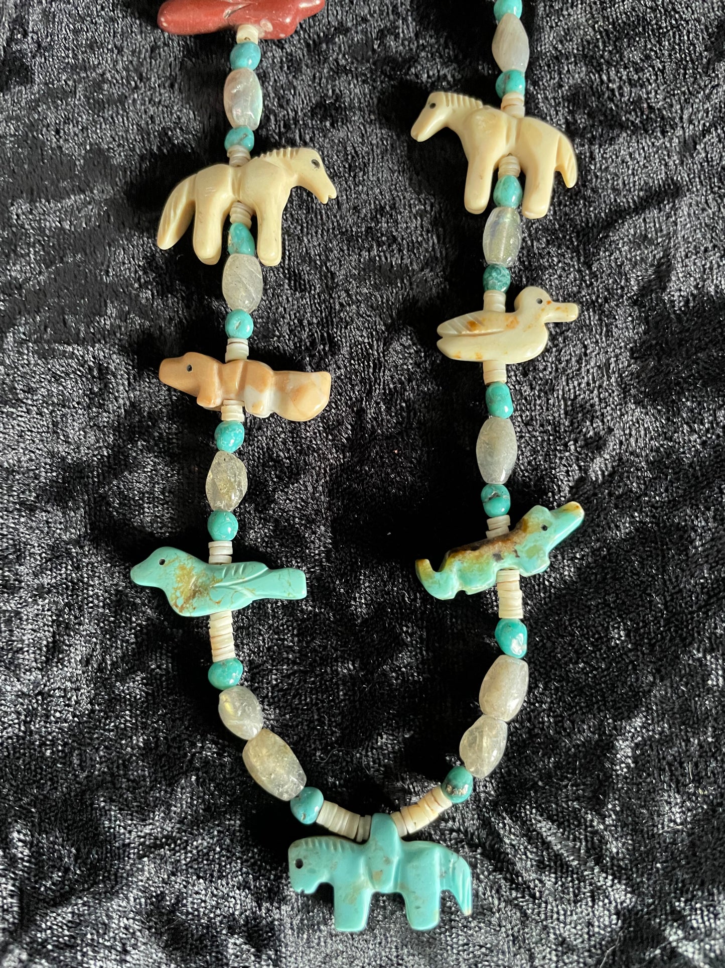 Traditional classic multi colored carved animal necklace